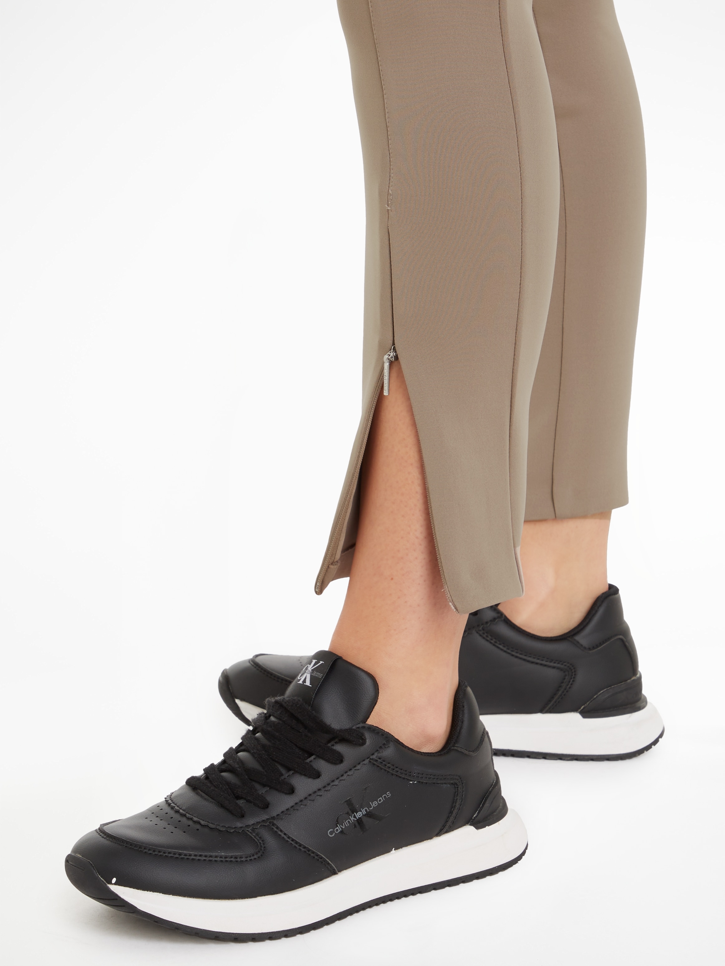Calvin Klein Leggings »TECHNICAL KNIT LEGGING«, mit Reissverschluss am Beinabschluss