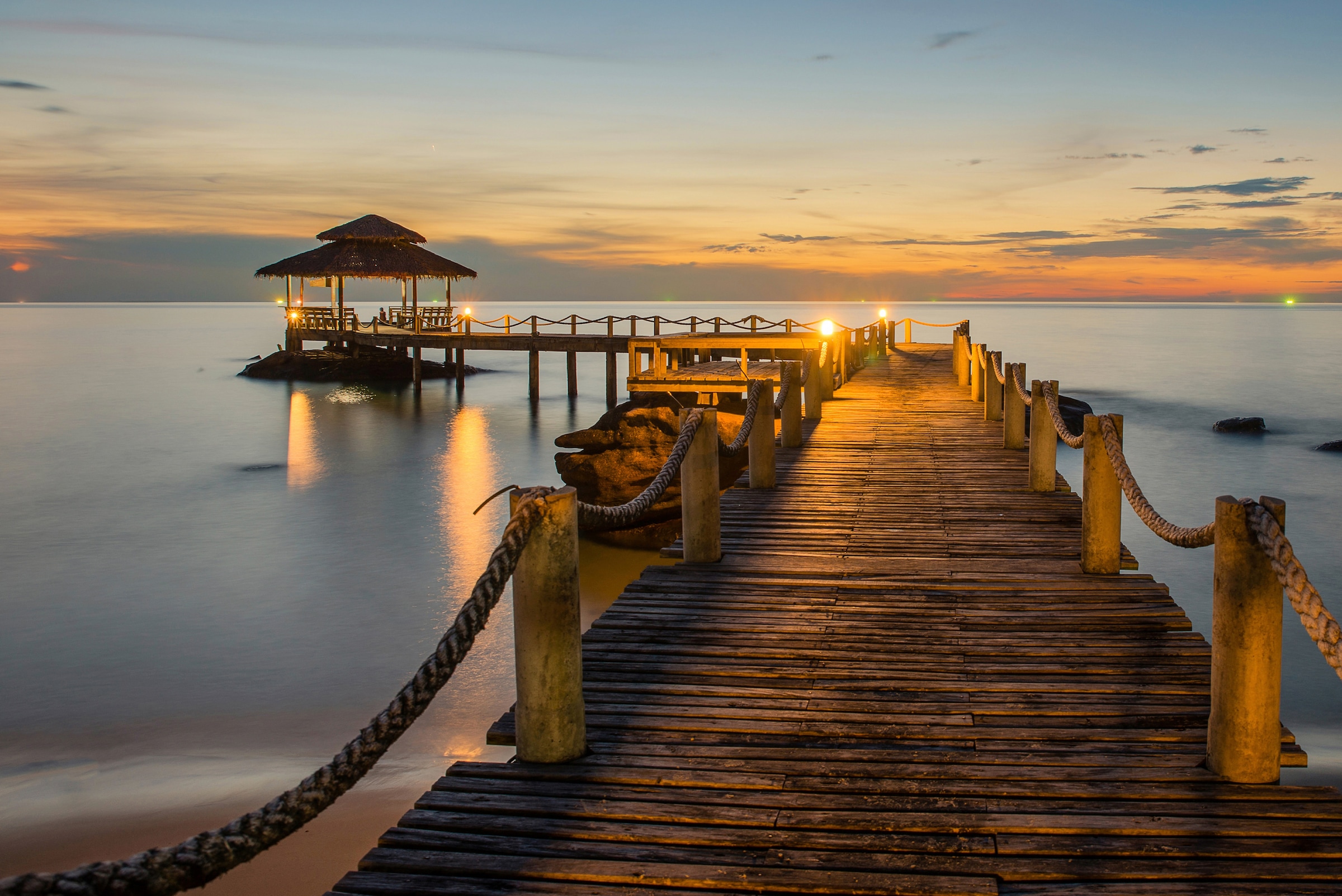 Image of Papermoon Fototapete "Wooded bridge pier between sunset" glatt