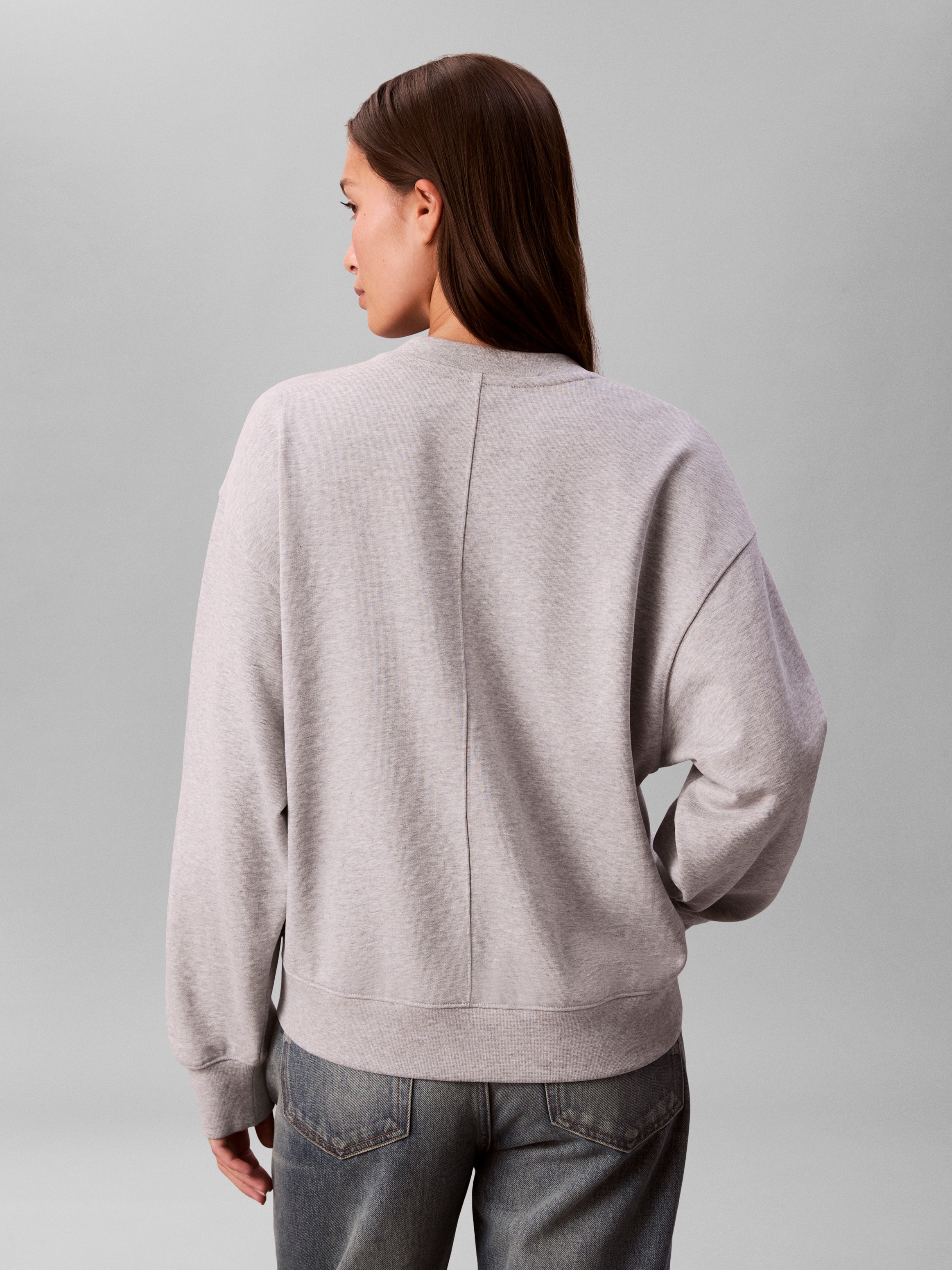 Calvin Klein Jeans Sweatshirt »LS TERRY WOVEN LABEL VNK SWEATSH«, Regular fit mit V-Ausschnitt
