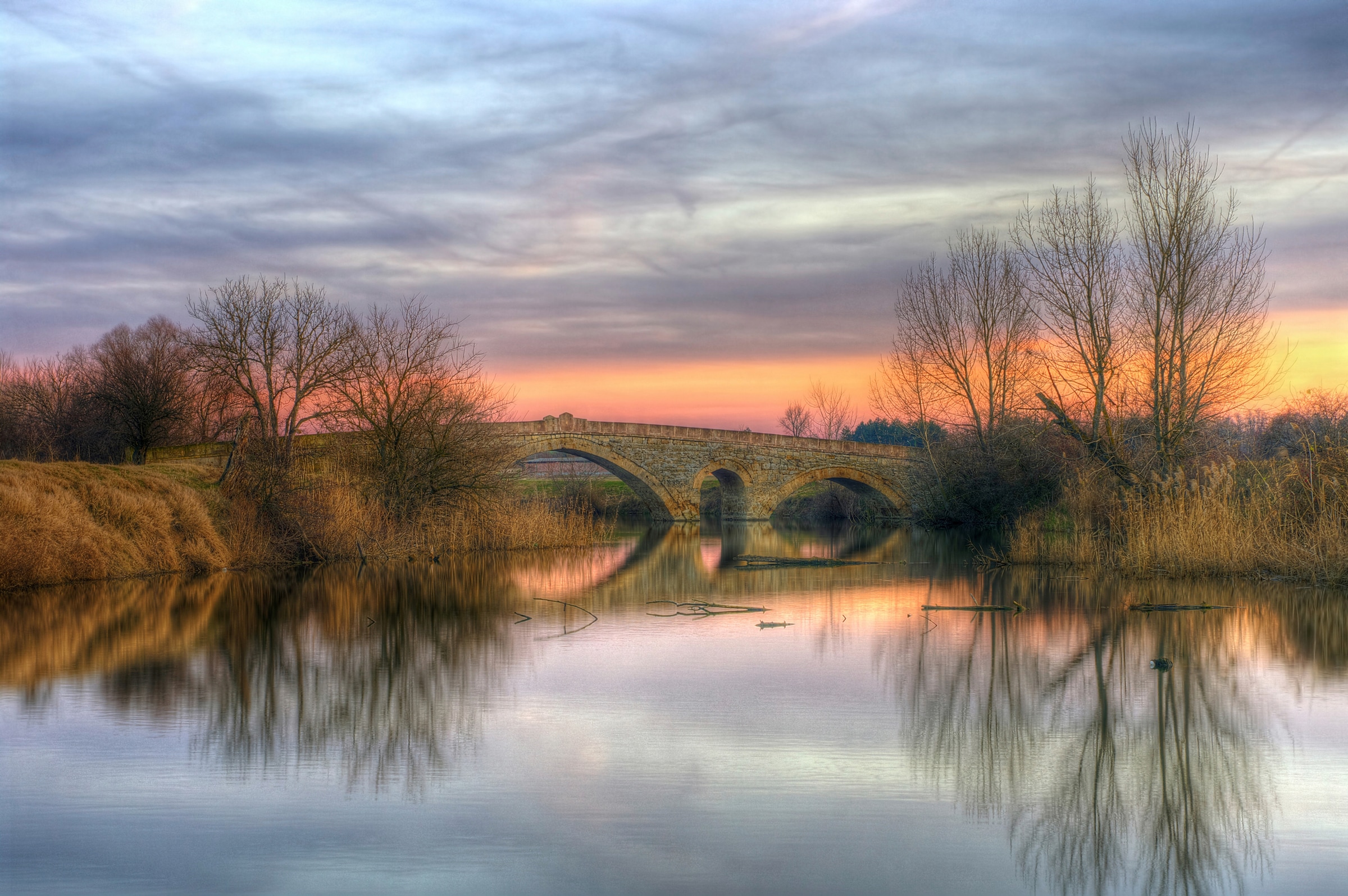 Image of Papermoon Fototapete "STEIN-BRÜCKE-FLUSS SEE STRAND SONNE WALD BÄUME NATUR"