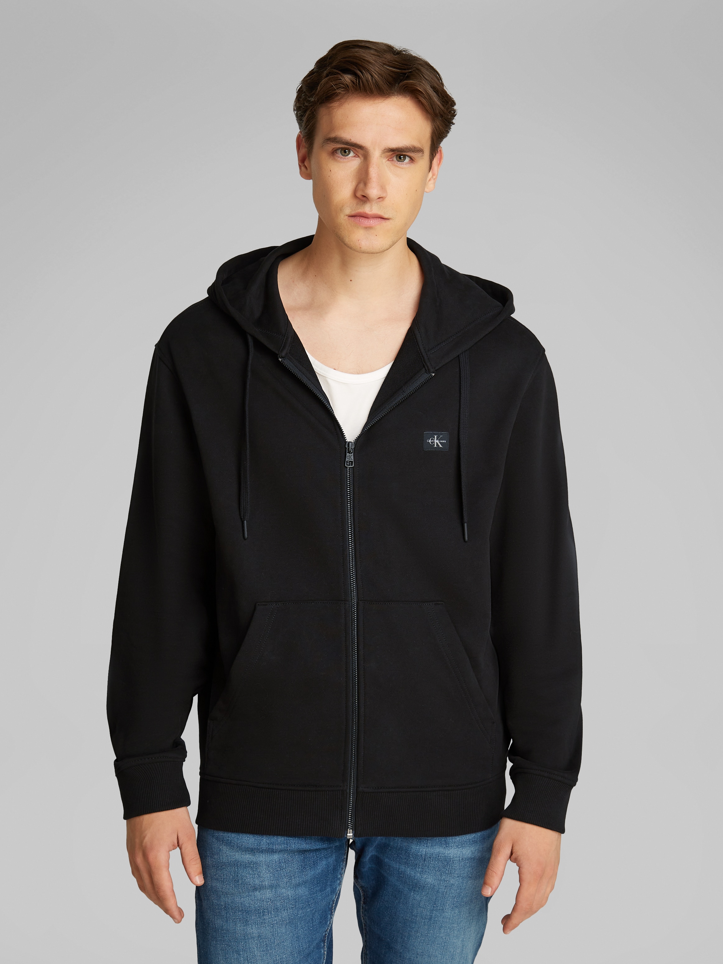 Calvin Klein Jeans Sweatjacke »WOVEN LABEL ZIP THROUGH HOODIE«, mit Logopatch