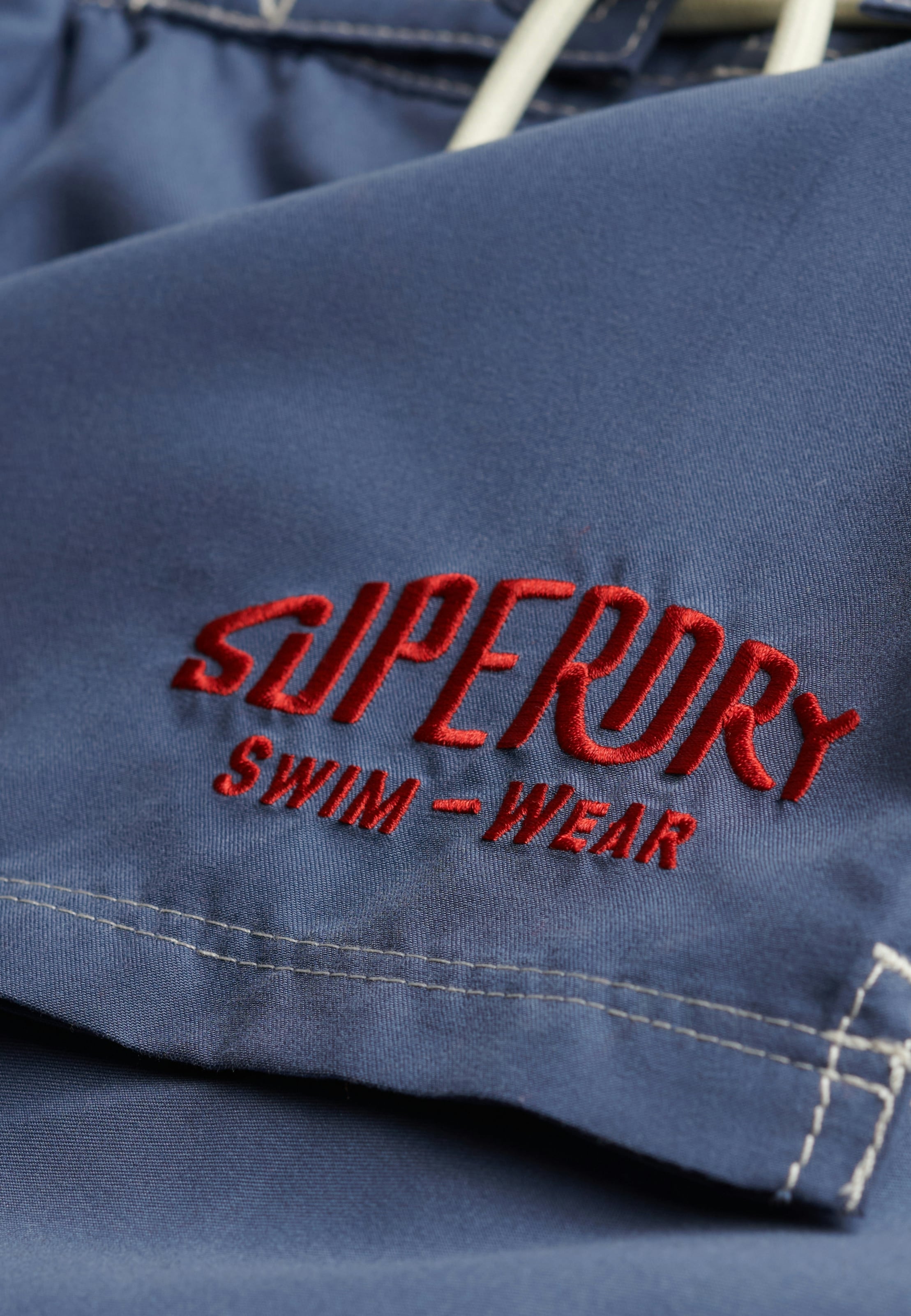 Superdry Badeshorts »CARGO 19 BOARDSHORT« lockere Passform, aus Polyester, unifarbenes Design