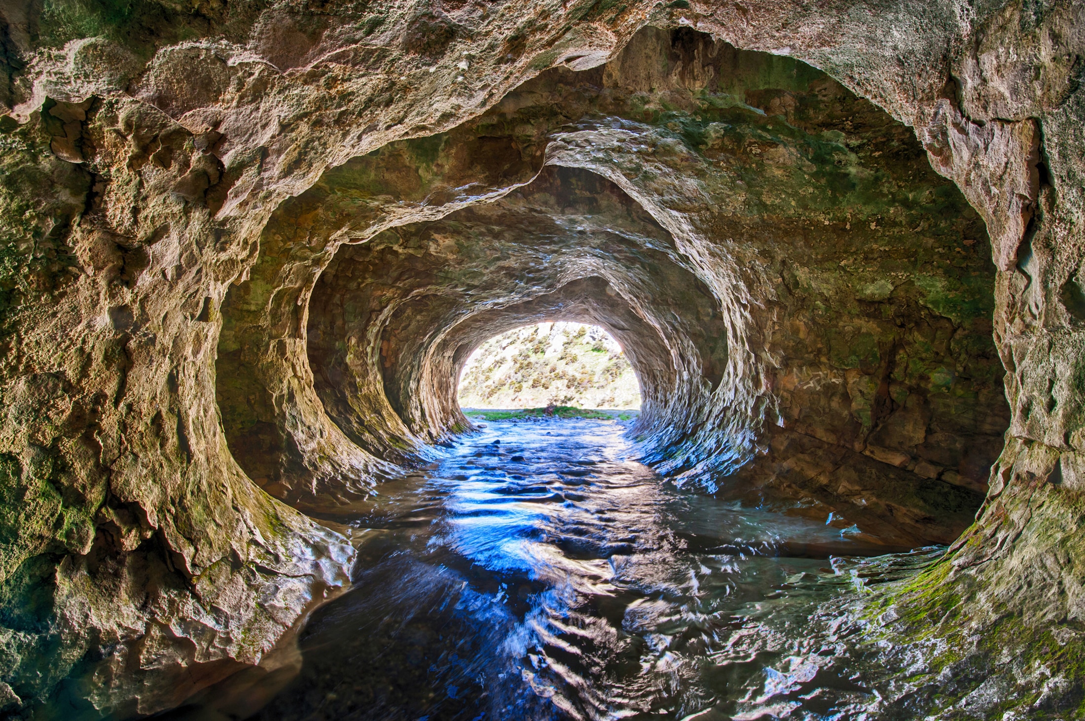 Image of Papermoon Fototapete "GROTTE-NEUSEELAND HÖHLE STROM BERGE MEER FLUSS FELSEN"