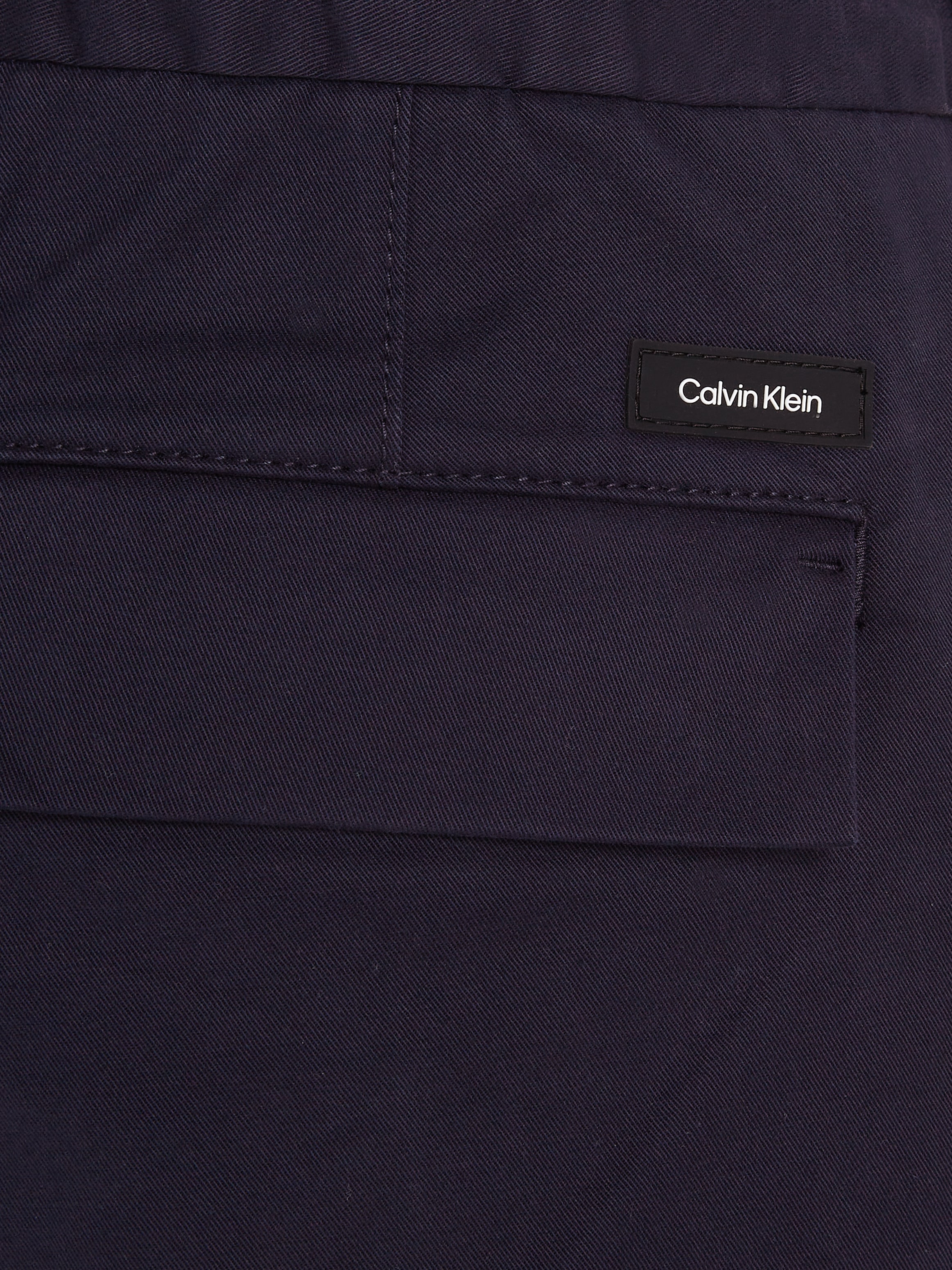 Calvin Klein Bügelfaltenhose »MODERN TWILL TAPERED PLEAT PANTS«, mit Logoprägung