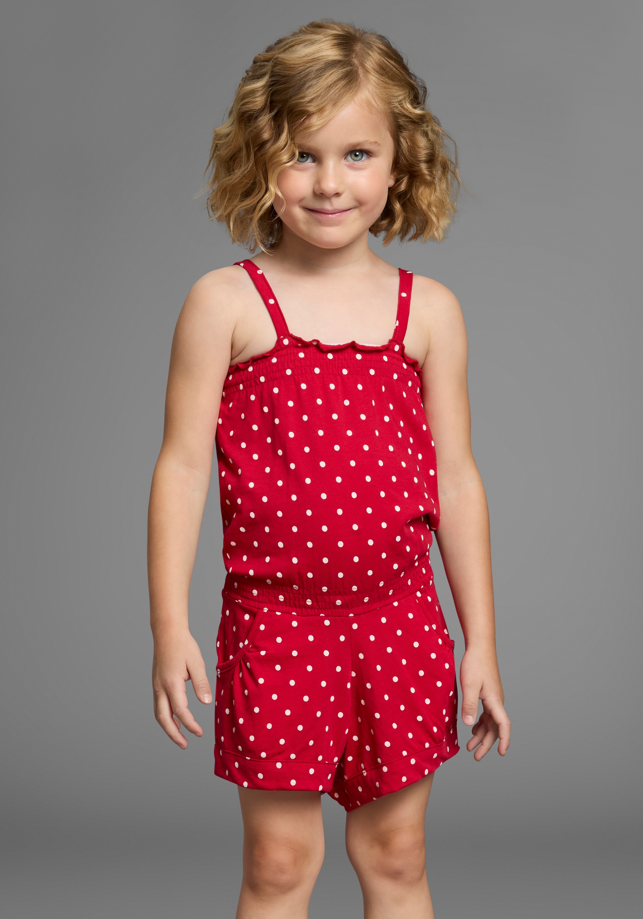 Image of KIDSWORLD Kurzoverall "für kleine Mädchen" niedlich gepunktet