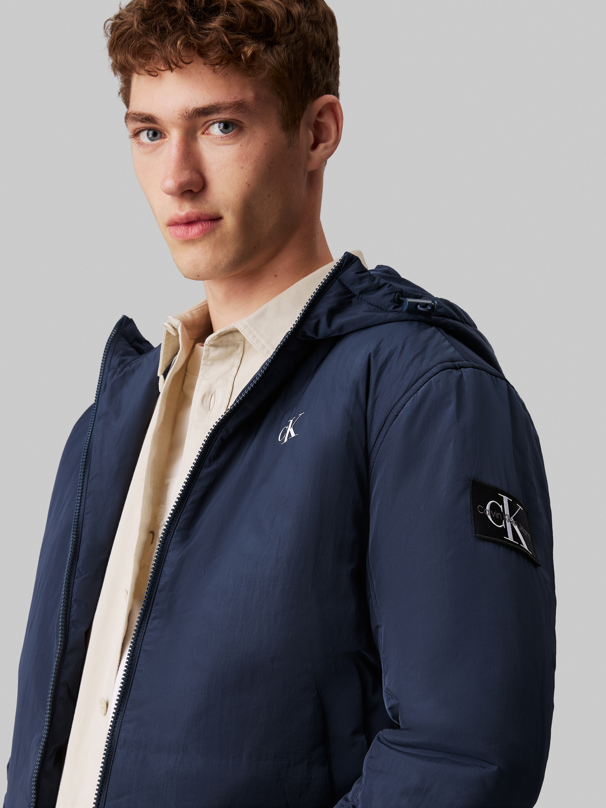 Calvin Klein Jeans Outdoorjacke »PADDED HOODED HARRINGTON« mit Kapuze mit Logoprägung