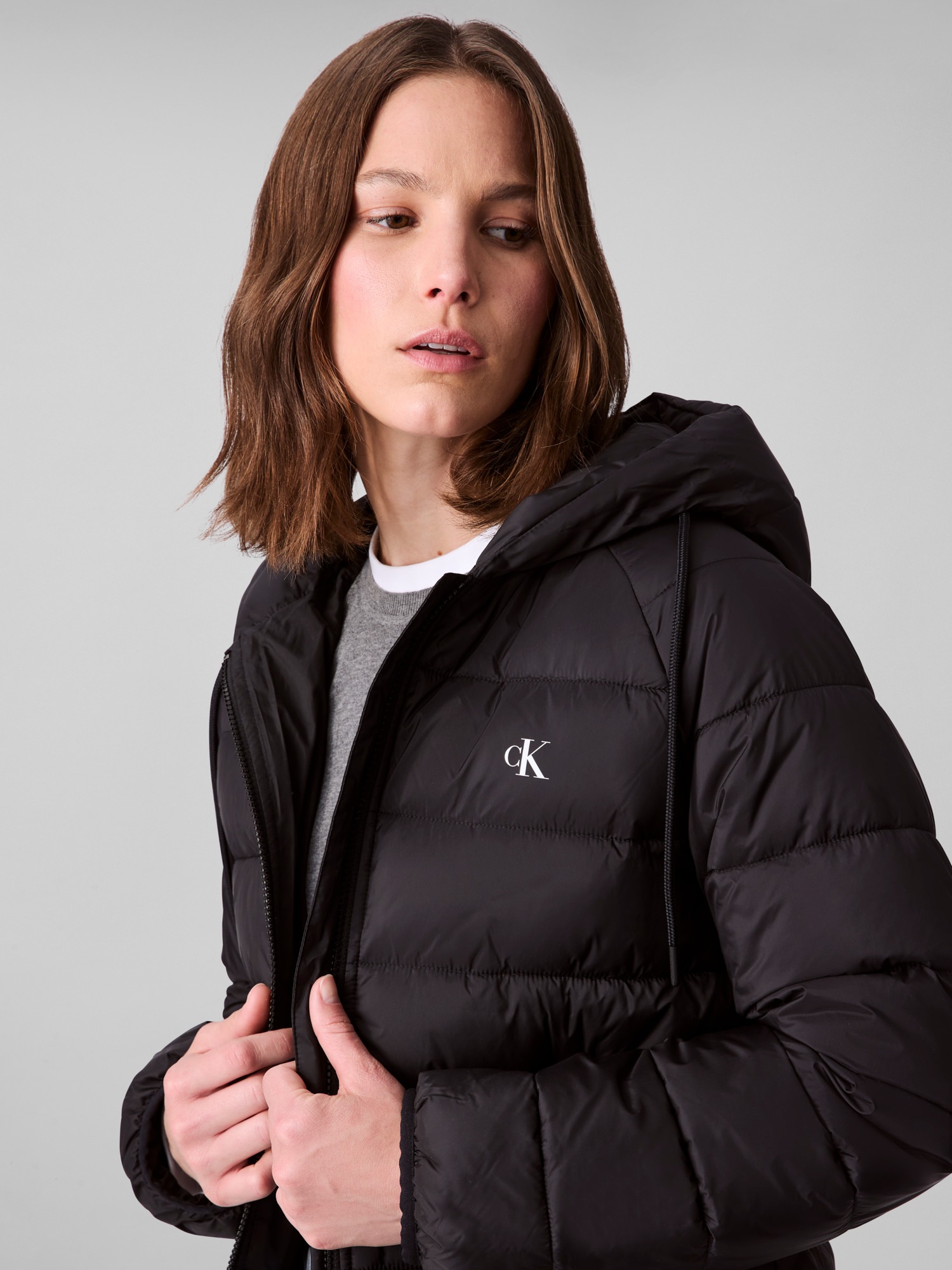 Calvin Klein Jeans Steppjacke »LIGHTWEIGHT LOGO PUFFER«, mit Kapuze, Mit Rundhalsausschnitt