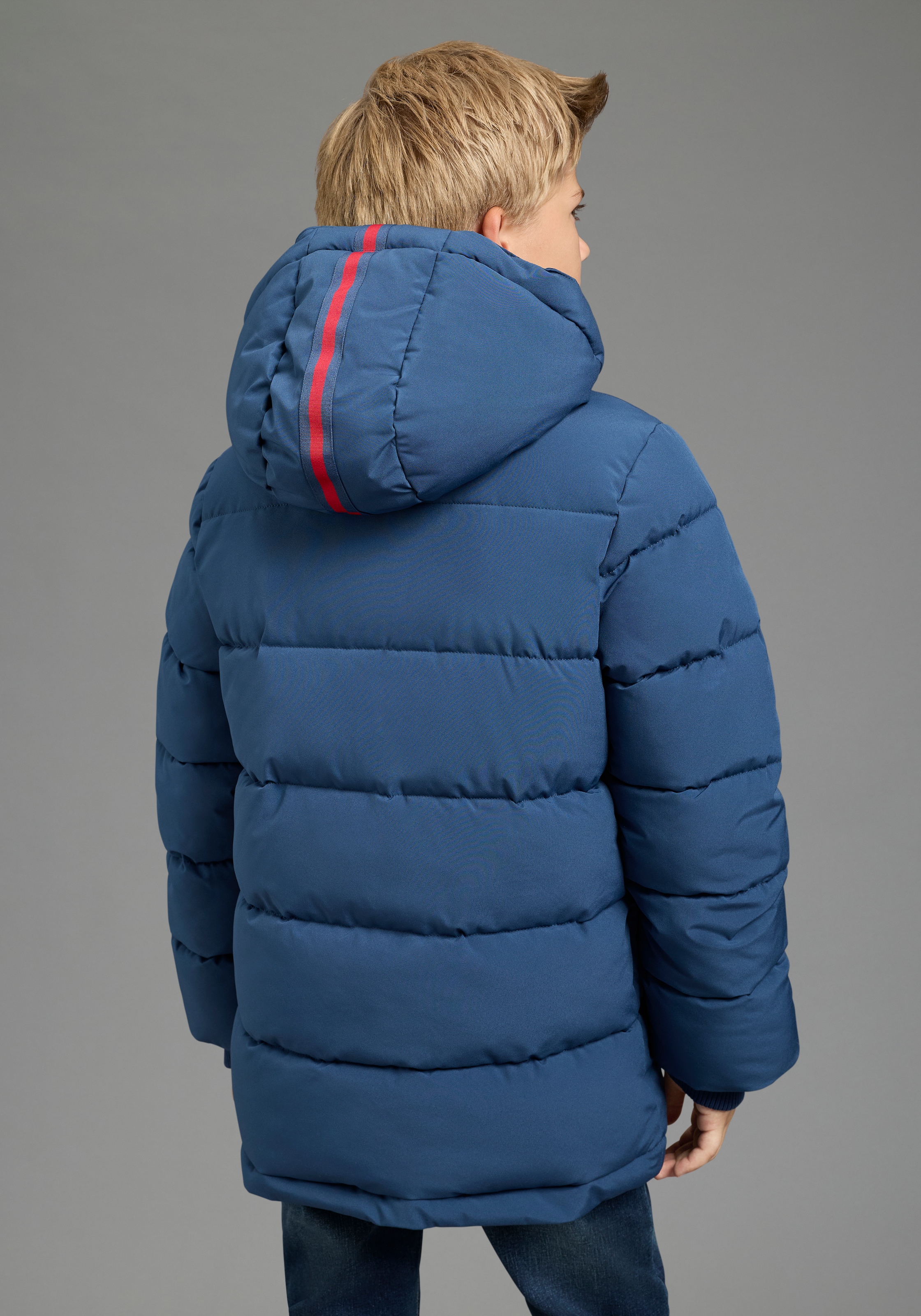 KIDSWORLD Outdoorjacke »Winterwarme Jacke, gesteppt« mit Kapuze Trendige Winterjacke mit refklektierenden Details