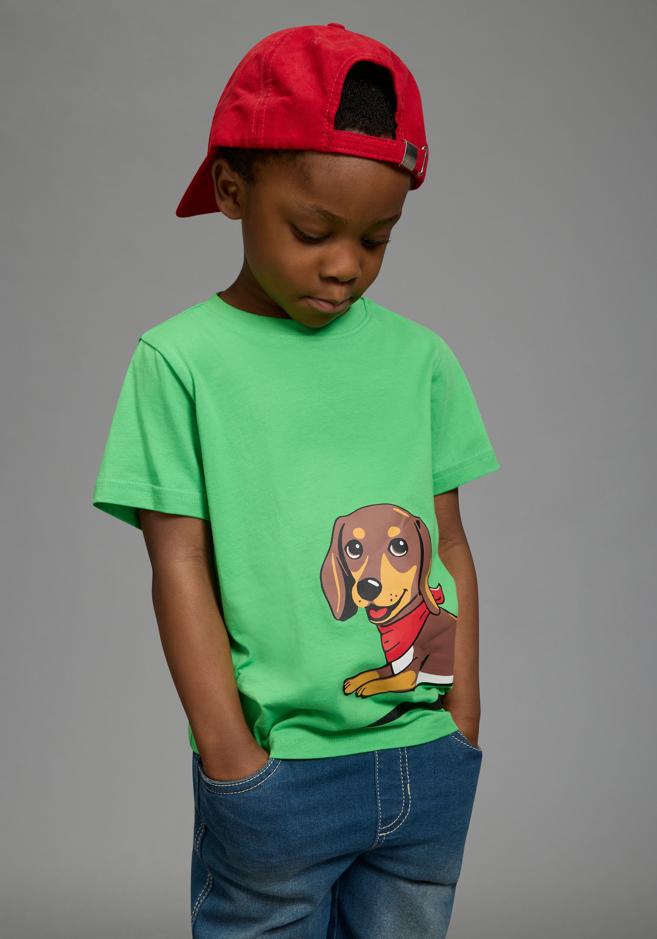 KIDSWORLD T-Shirt »Shirt mit rundum Dackel-Print« Basic Passform, Kurzarm, bedruckte Optik, aus Baumwolle