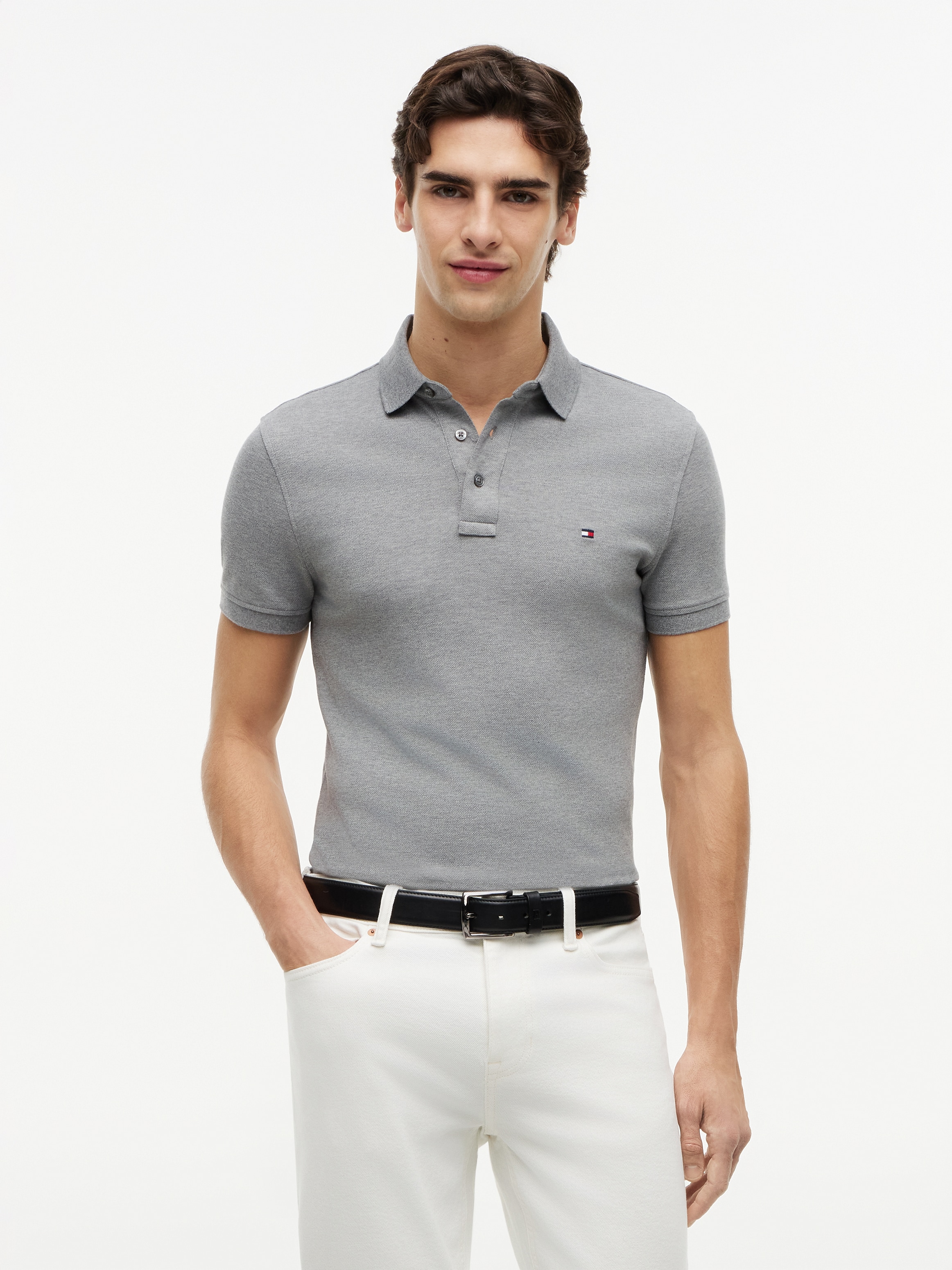Image of Tommy Hilfiger Poloshirt "1985 SLIM POLO mit Piqué-Struktur und Stickerei" meliert, casual, slim fit, Baumwollmix, Polokragen