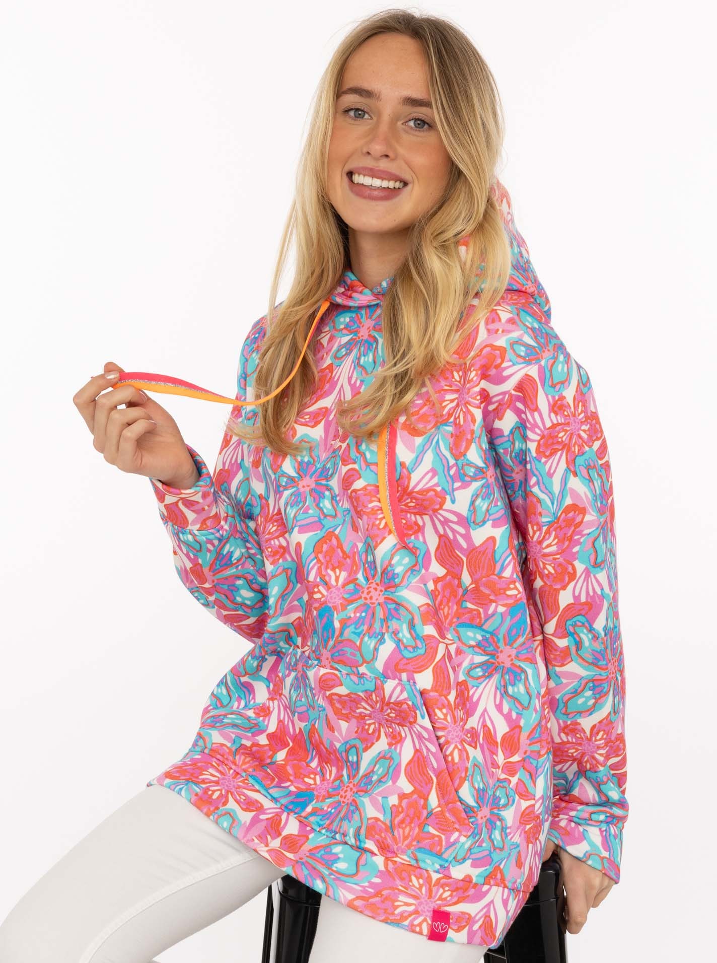 Image of Zwillingsherz Hoodie ""Flower Sparkles"", farbenfrohes florales Muster, Neondetails, Kapuze, Fronttasche