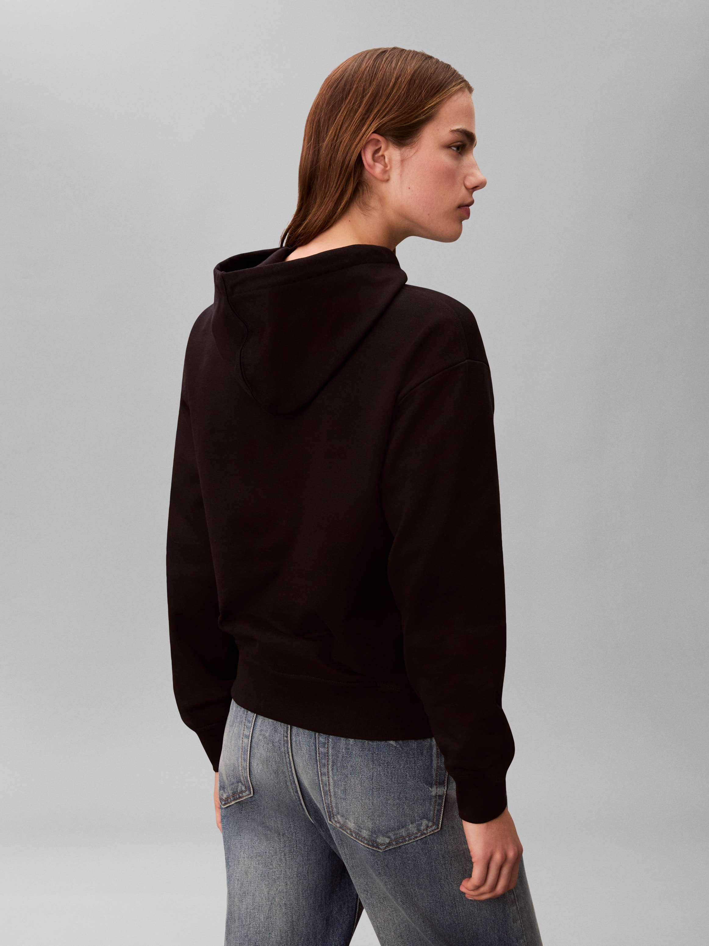 Calvin Klein Jeans Kapuzensweatshirt »MONOLOGO«, Regular fit mit Kapuze und Kängurutasche
