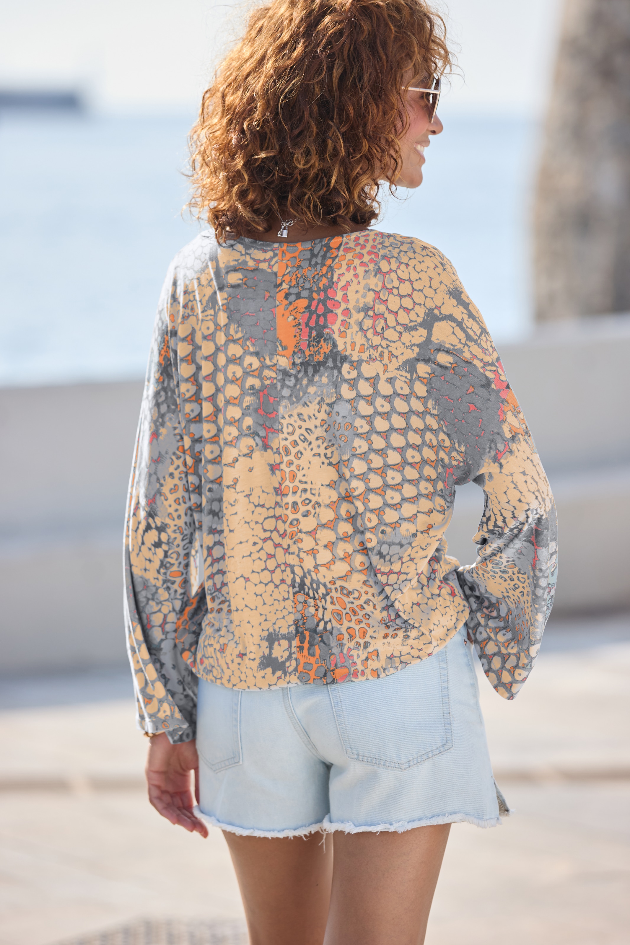 Buffalo T-shirt chauve-souris , mit Animaldruck, lockere Bluse mit V-Ausschnitt, Blusenshirt
