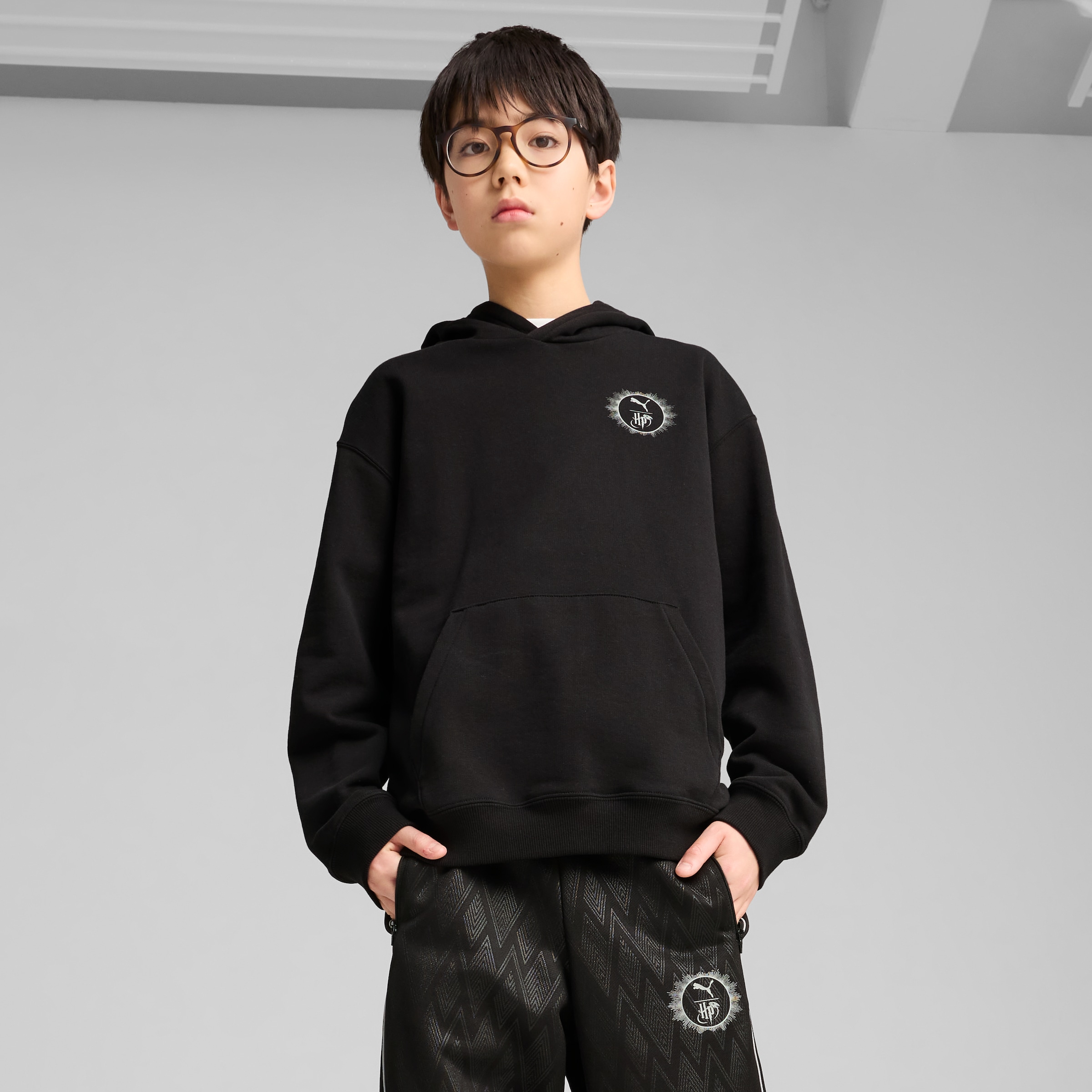 Image of PUMA Kapuzensweatshirt "X HARRY POTTER RELAXED GRAPHIC HOODIE TR", mit Kängurutasche, mit gerippten Bündchen und Saum