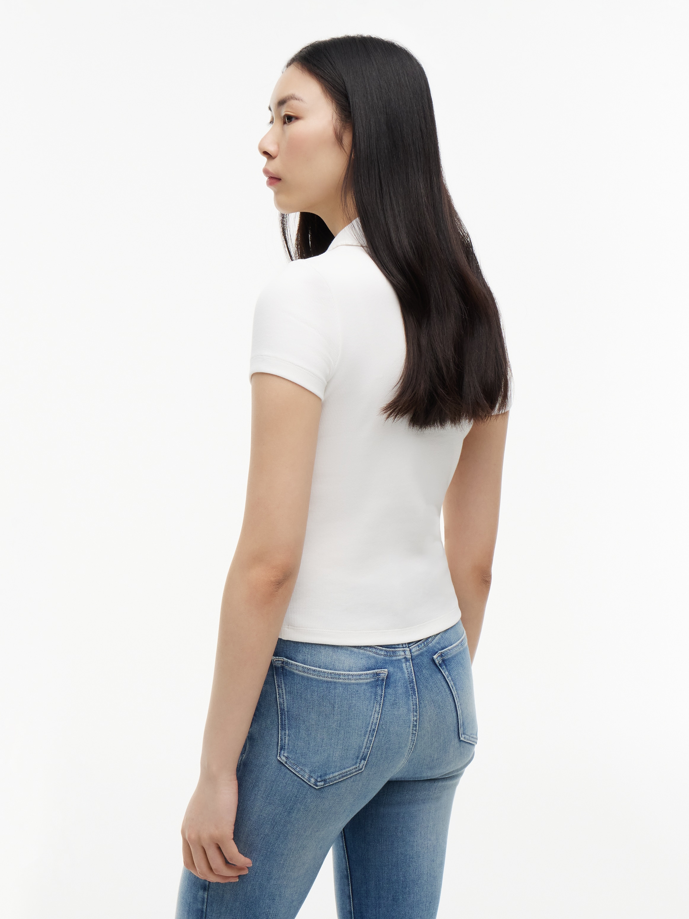 Tommy Jeans Poloshirt »TJW SLIM RIB SCRIPT POLO« Baumwollmischung, slim fit, figurbetont, in gerippter Struktur