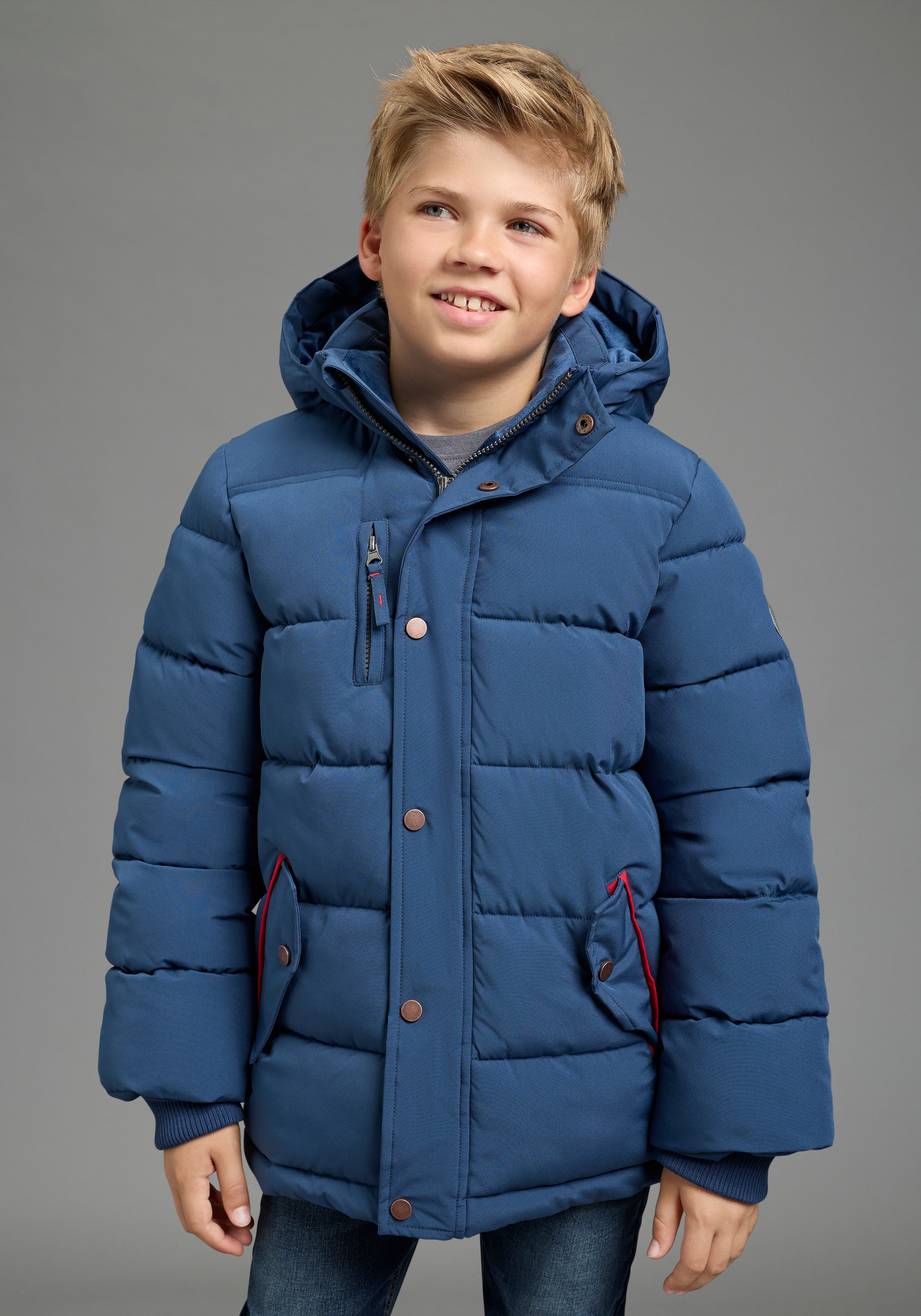 KIDSWORLD Outdoorjacke »Winterwarme Jacke, gesteppt« mit Kapuze Trendige Winterjacke mit refklektierenden Details