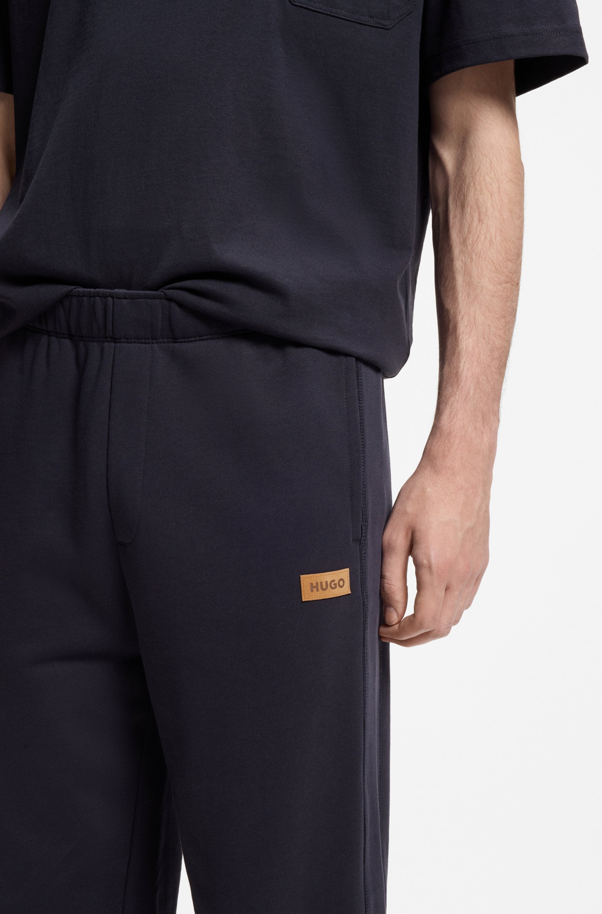 HUGO Pantalon sweat »Nevatro«  Regular Fit, Zierhosenschlitz, elastische Bündchen