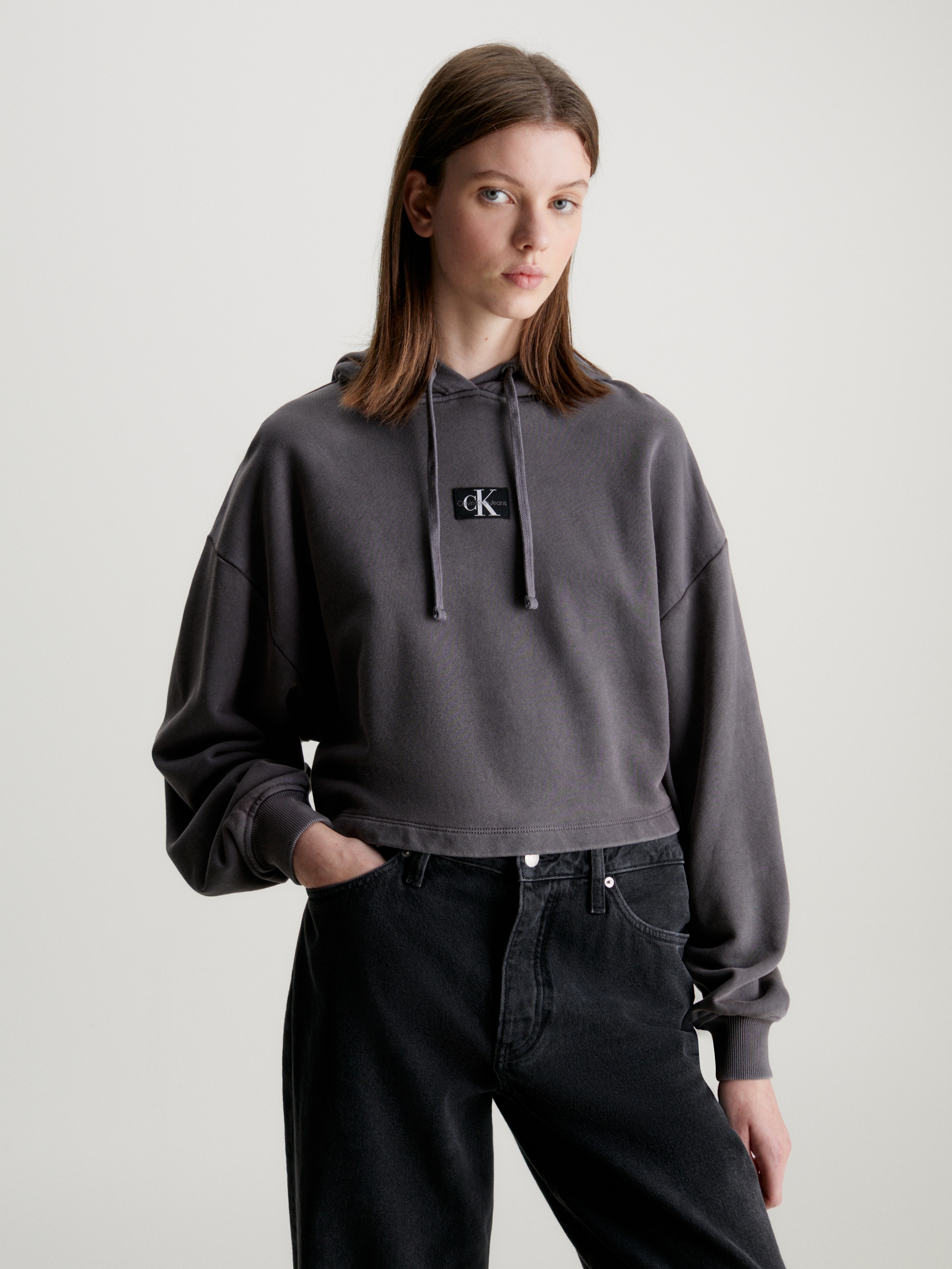 Calvin Klein Jeans Kapuzensweatshirt »WASHED WOVEN LABEL HOODIE«, mit Logoschriftzug