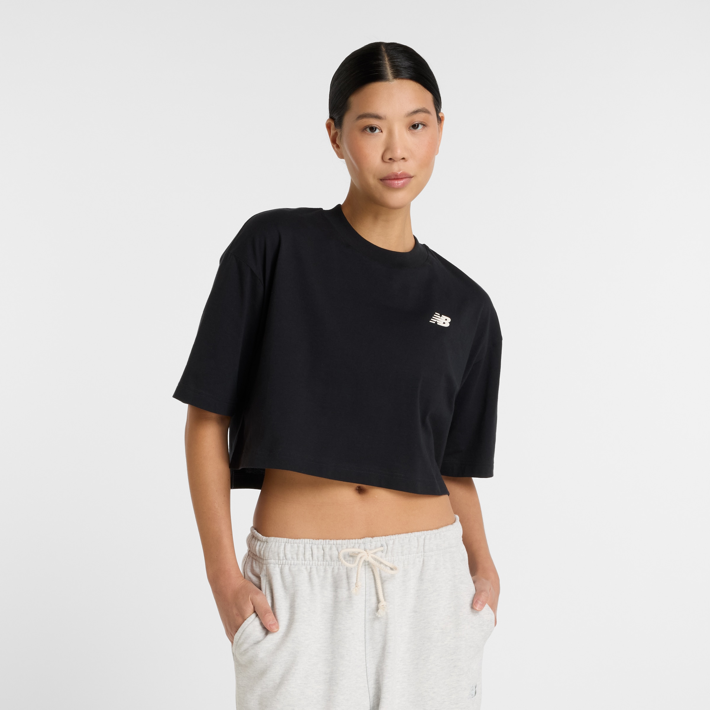 Image of New Balance T-Shirt "Reimagined Oversized Waist T-Shirt" taillenbetonte Form, Oversized-Schnitt, aus Polyester und Elasthan