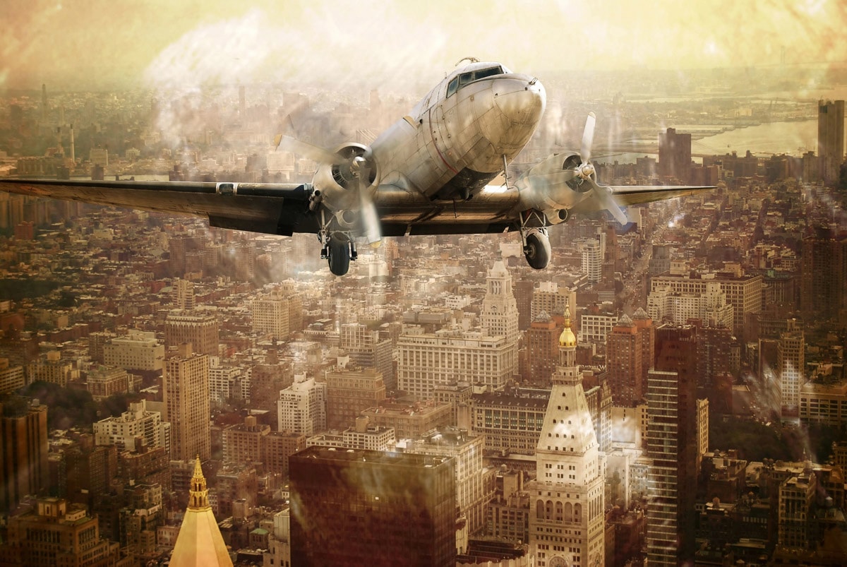 Image of Papermoon Fototapete "Flugzeug über Stadt"