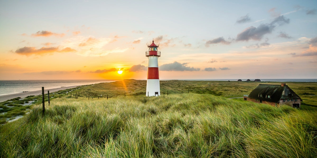 Image of Papermoon Fototapete "Leuchtturm am Strand"