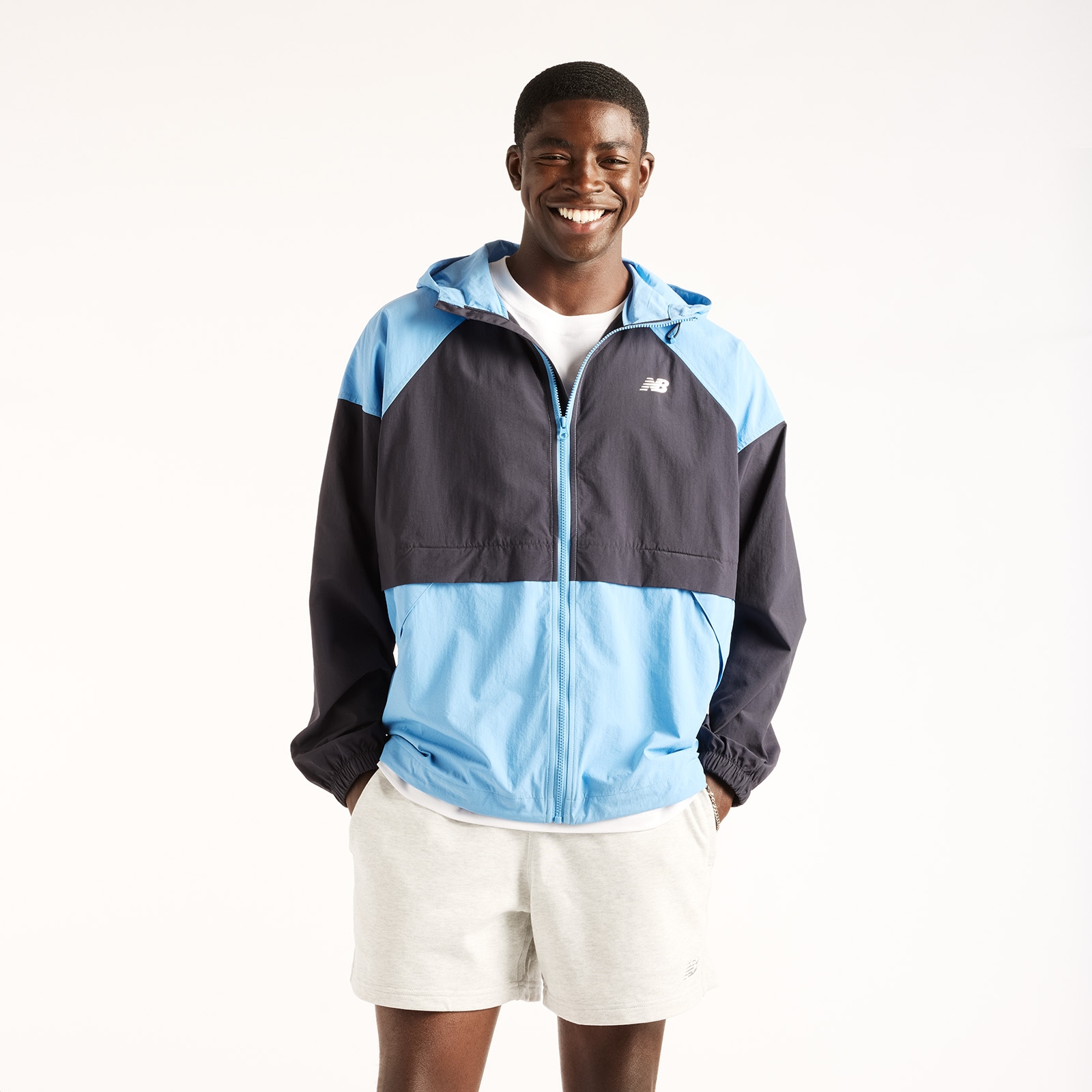 Image of New Balance Windbreaker "SPORT ESSENTIALS FZ JACKET" mit Kapuze Oversized geschnittene Windjacke, wasserabweisend