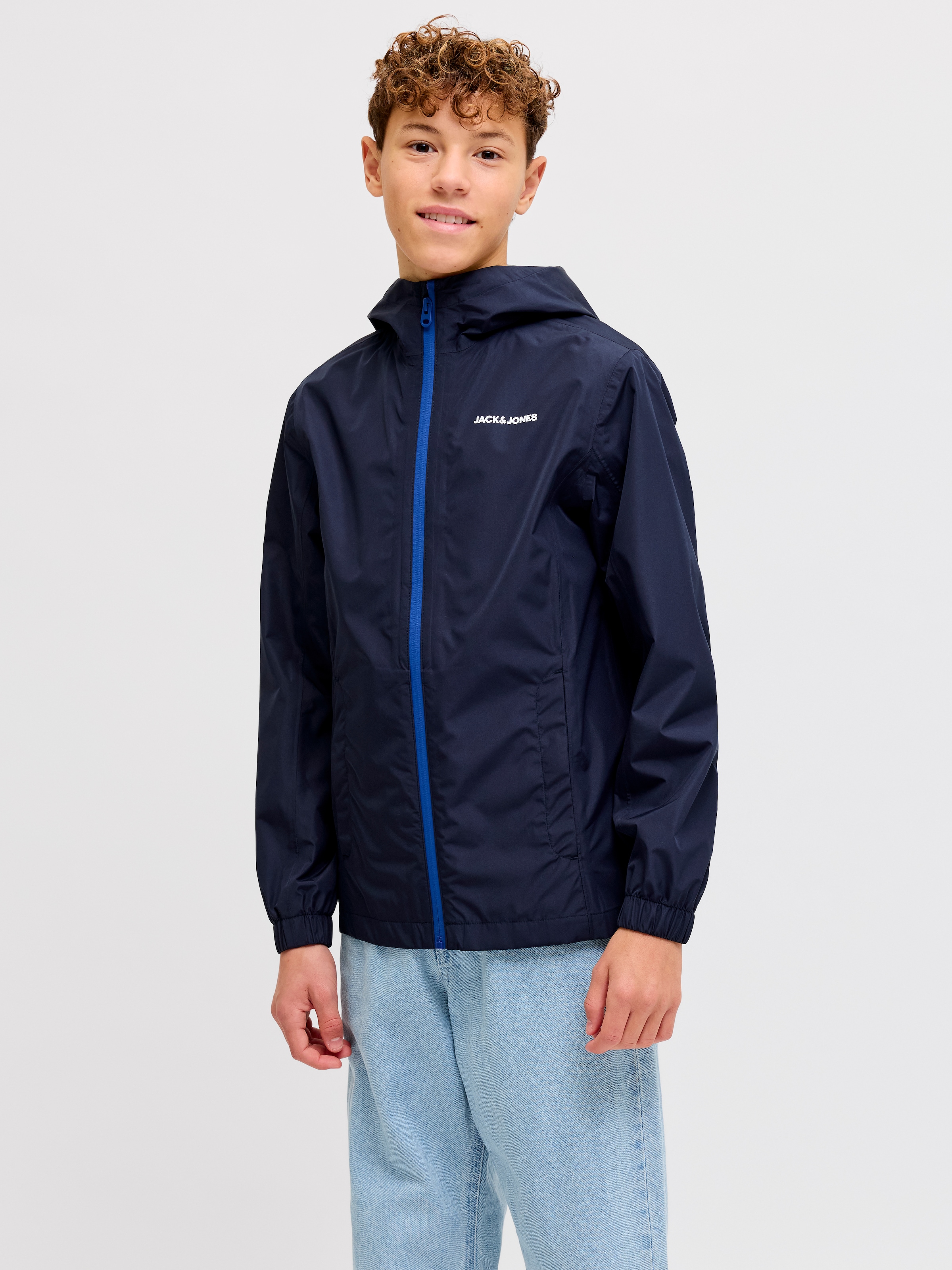 Image of Jack & Jones Junior Regenjacke "JJEFLYNN RAIN JACKET SN JNR" mit Kapuze