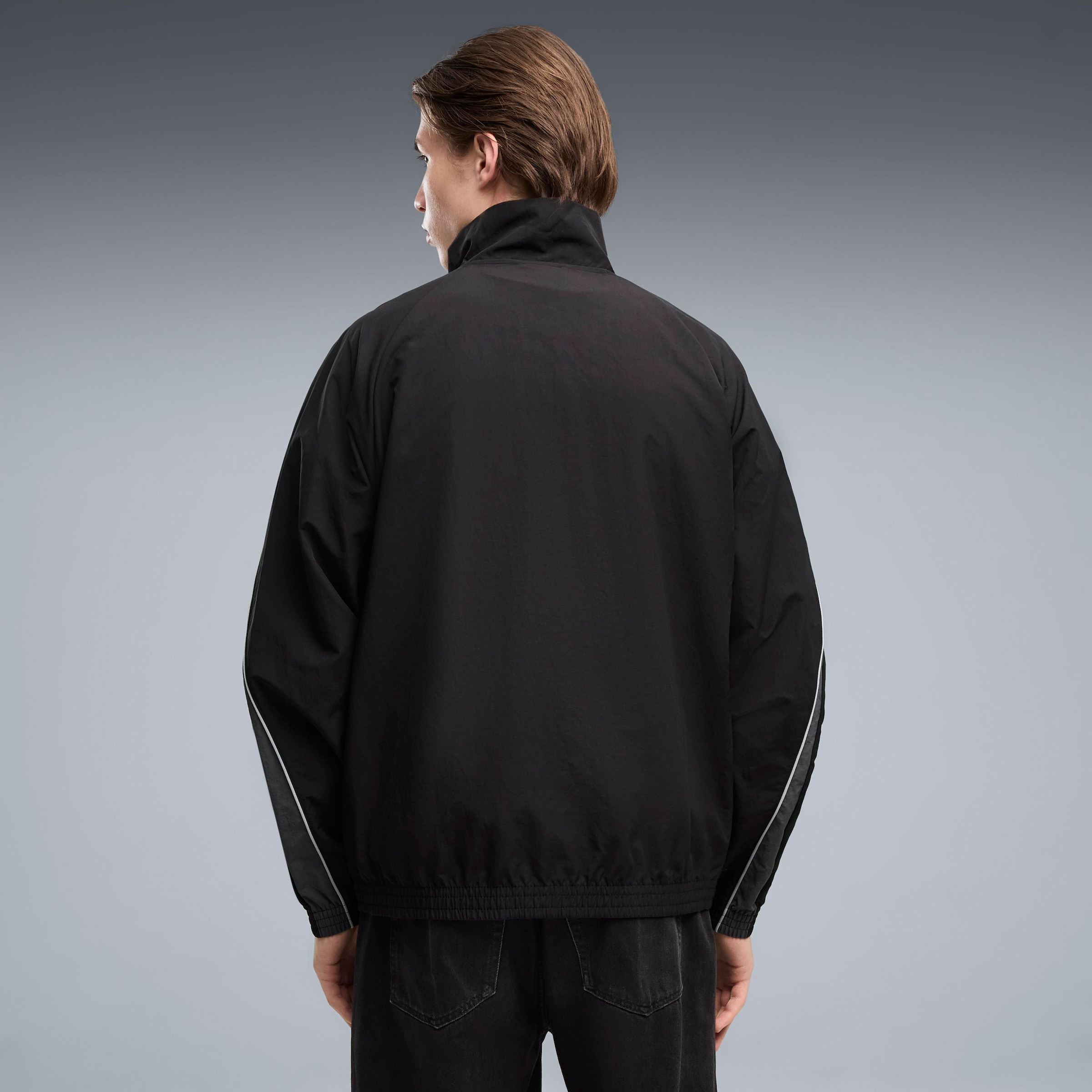 PUMA Veste d'entraînement »SPORT RELAXED WOVEN TRACK JACKET« sans capuche avec col montant, aspect imprimé, coupe décontractée, longueur normale